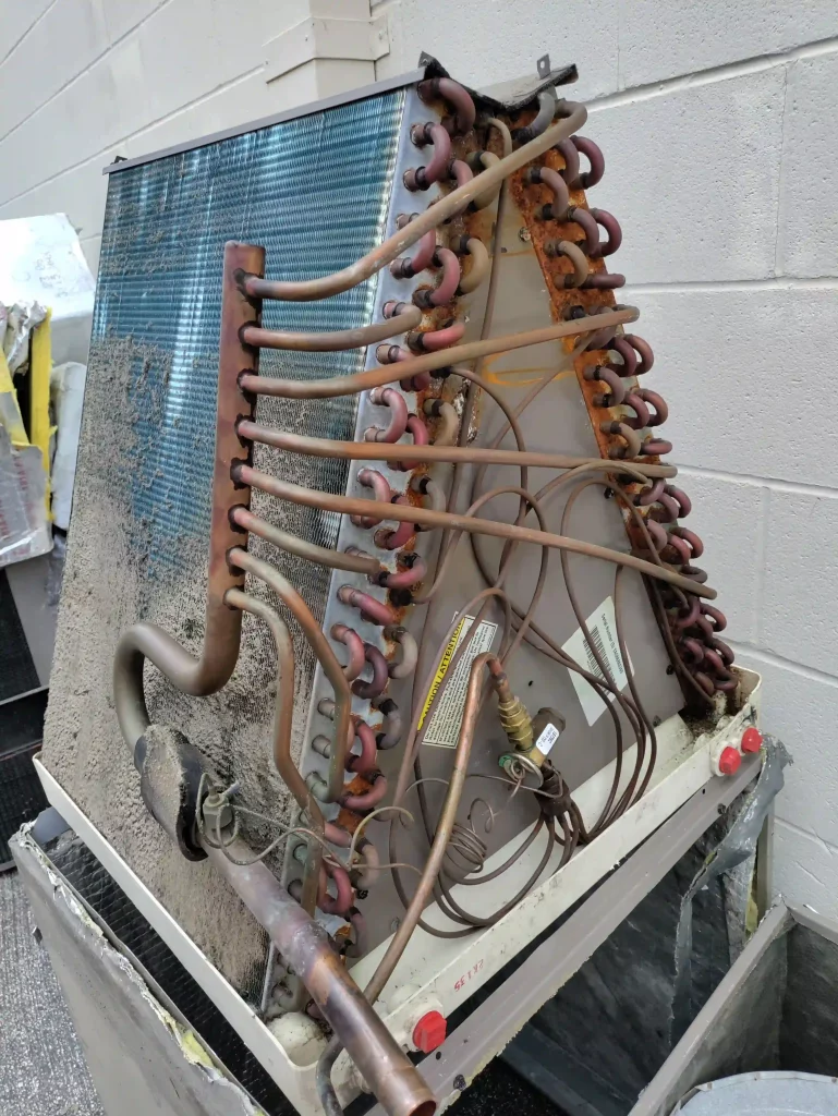 The evaporator coil is the part of an air conditioner or heat pump that absorbs the heat from the air in your house. Dirty or corroded coils significantly reduce AC efficiency leading to poor cooling performance and increased strain on the entire system.